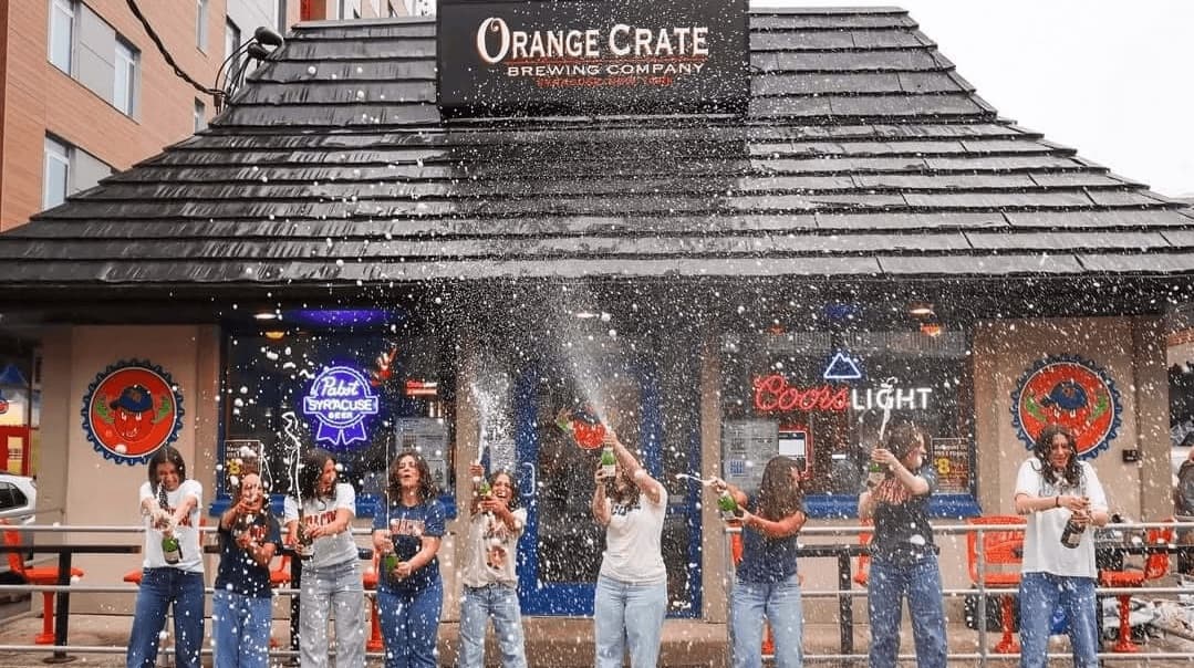 Fans celebrating outside Orange Crate Brewing Company